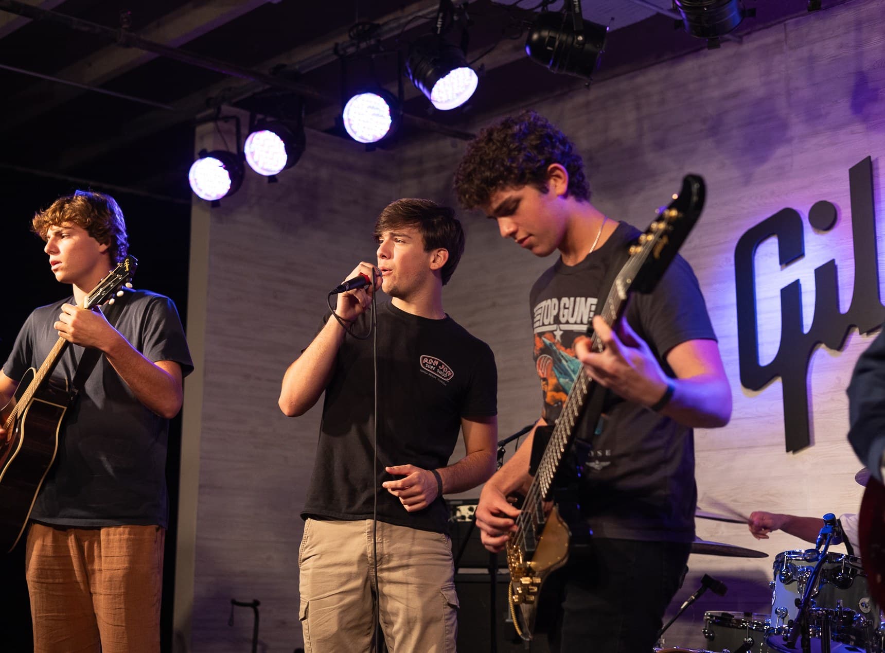 Live band performance under stage lights