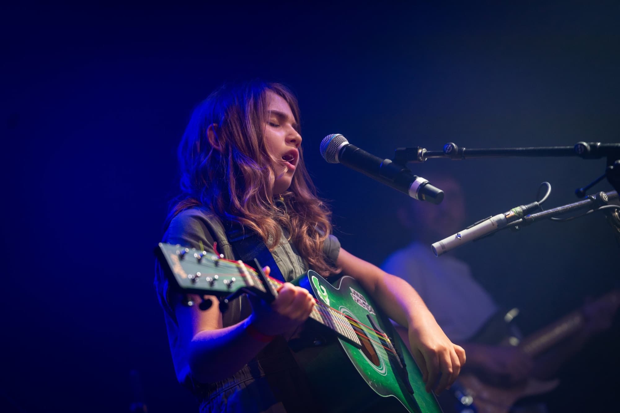 Rising Stars guitarist performing on stage