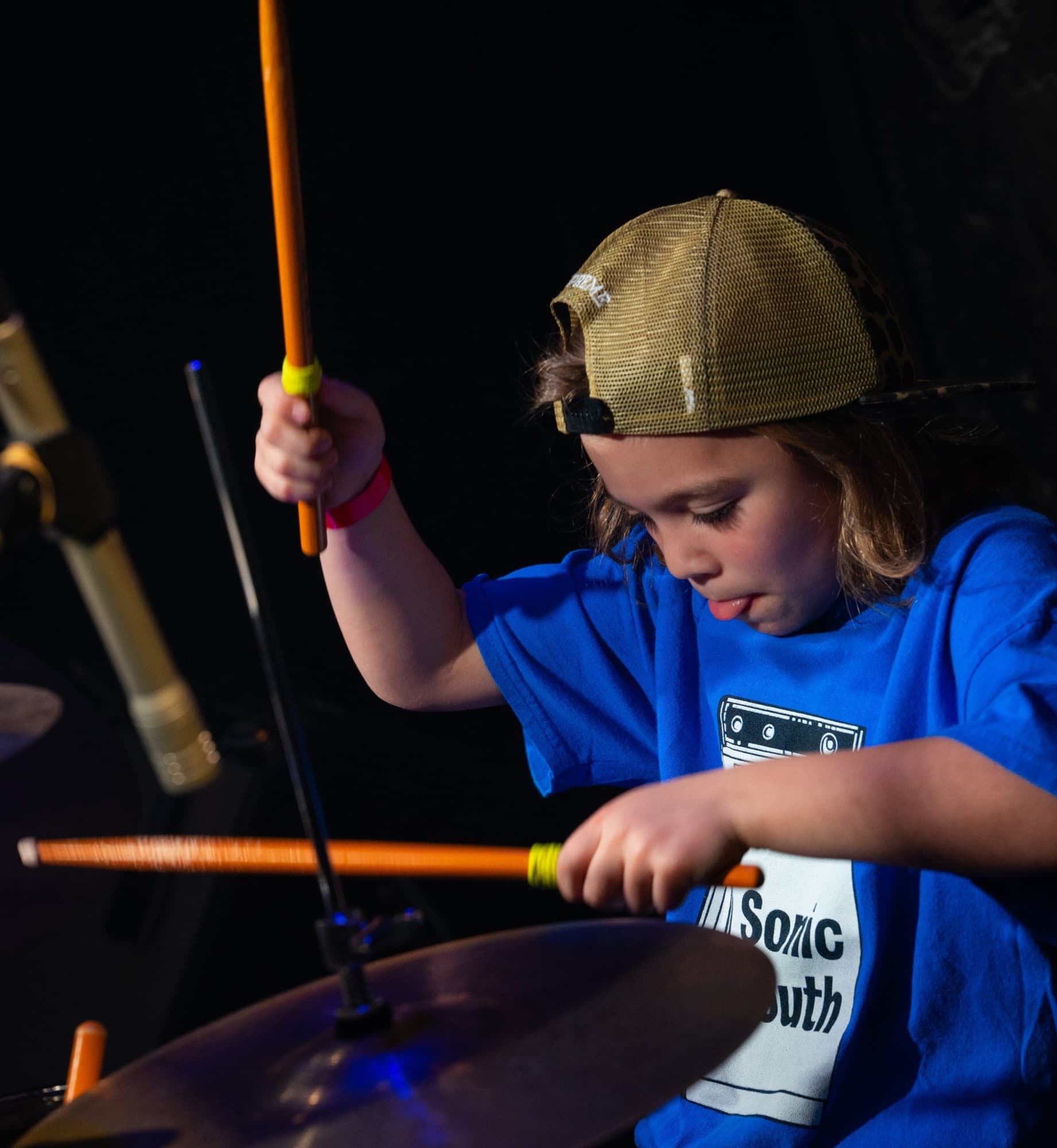 Young Rock Juniors musician playing drums